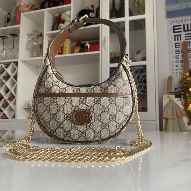 G*u*i top handle bags